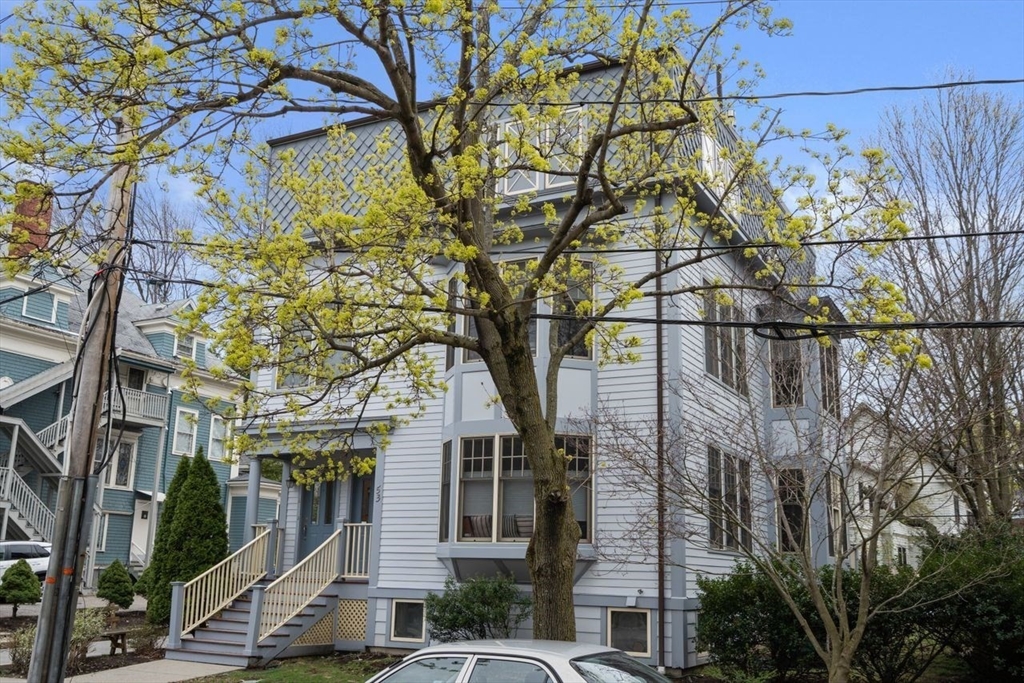 a view of a house with a tree