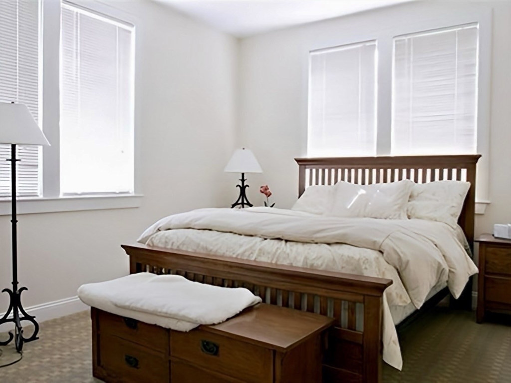 53 Winslow Road Brookline, MA 02446 - Photo 13 of 23 a bedroom with a bed and window