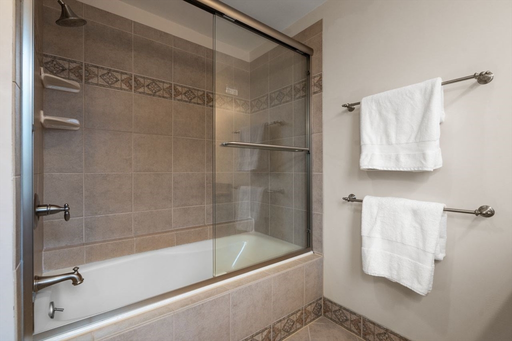 53 Winslow Road Brookline, MA 02446 - Photo 16 of 23 a bath tub sitting next to a shower