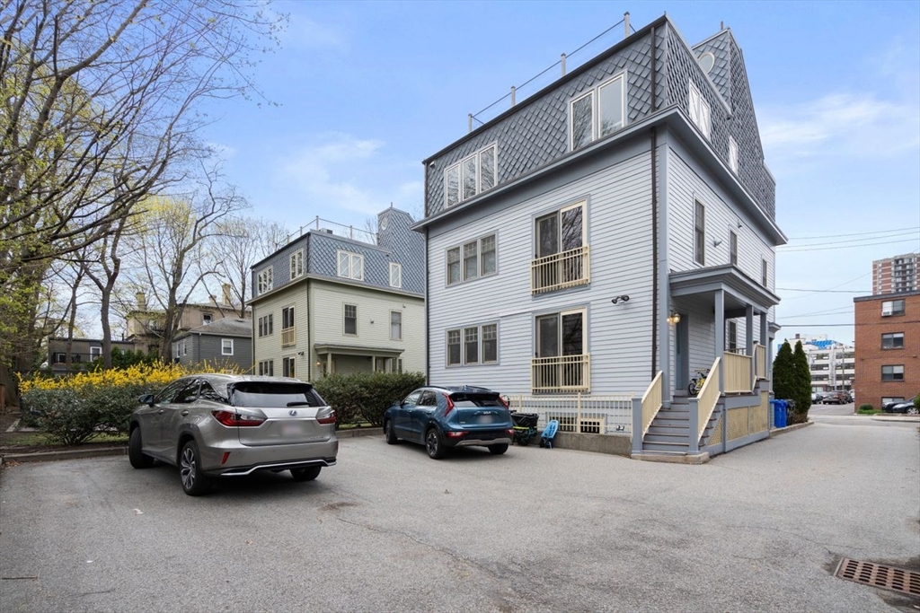 53 Winslow Road Brookline, MA 02446 - Photo 20 of 23 a car parked in front of a white house