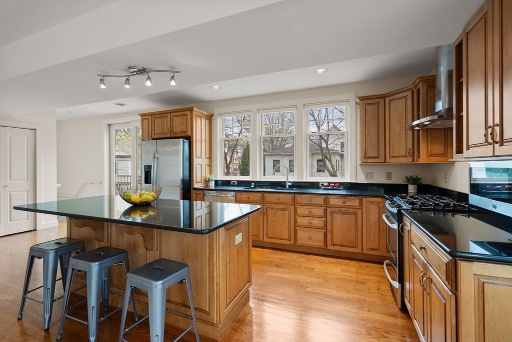 53 Winslow Road Brookline, MA 02446 - Photo 5 of 23 a kitchen with granite countertop a sink and counter space