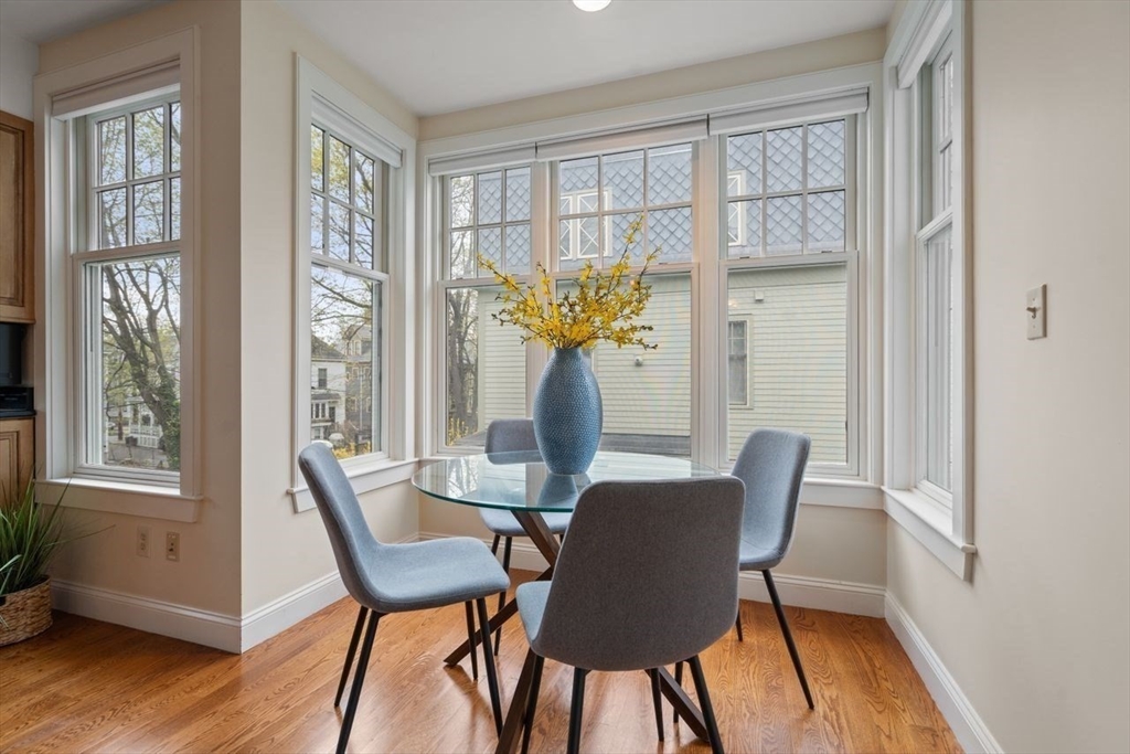 53 Winslow Road Brookline, MA 02446 - Photo 8 of 23 a view of a dining room with furniture window and wooden floor