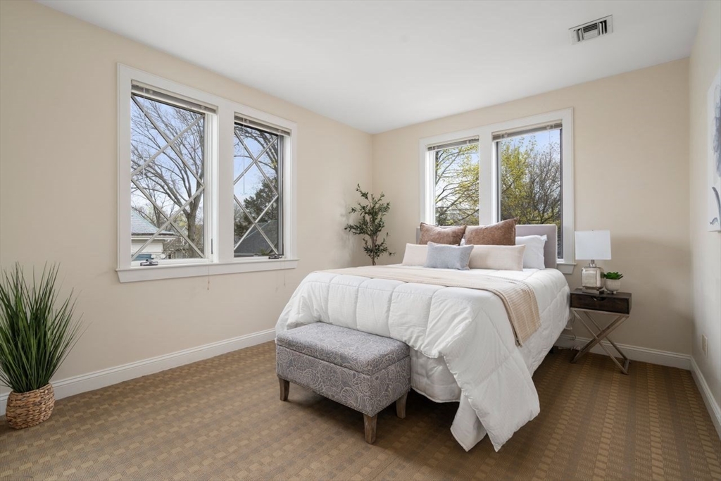 53 Winslow Road Brookline, MA 02446 - Photo 10 of 23 a bedroom with a bed and a large window