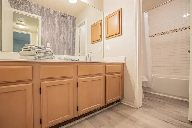 a close view of a utility room with dryer and washer