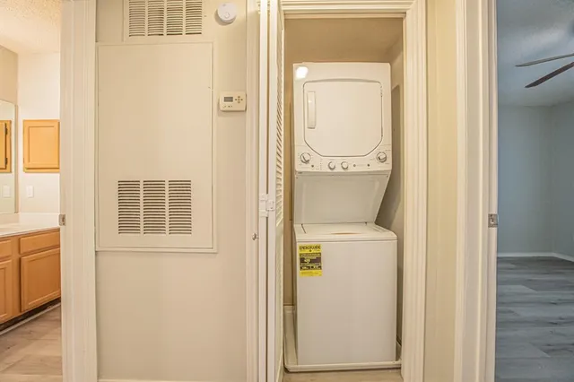 wooden floor fireplace and windows in an empty room