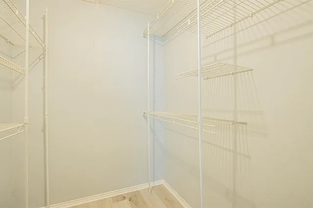 a view of a swimming pool with outdoor seating and plants