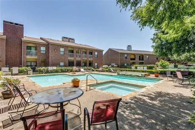 an aerial view of a residential houses with outdoor space