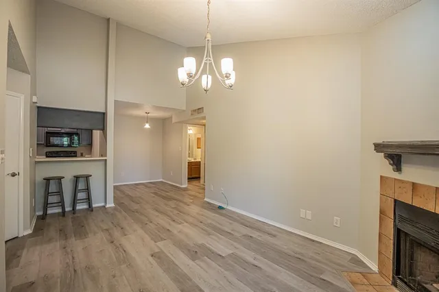 a kitchen with stainless steel appliances a refrigerator stove and microwave