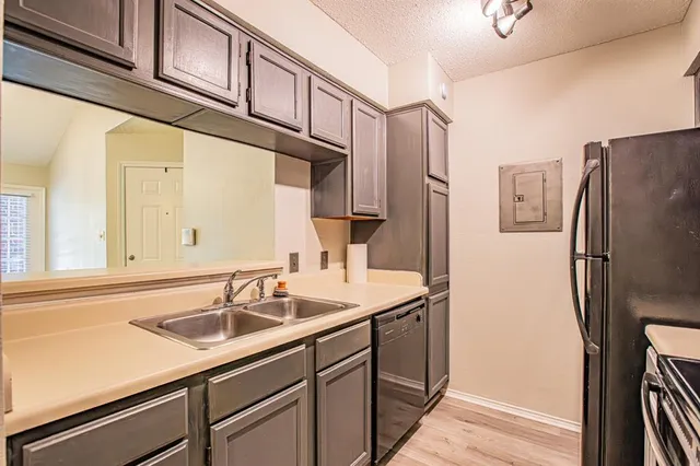 a view of an empty room and fire place