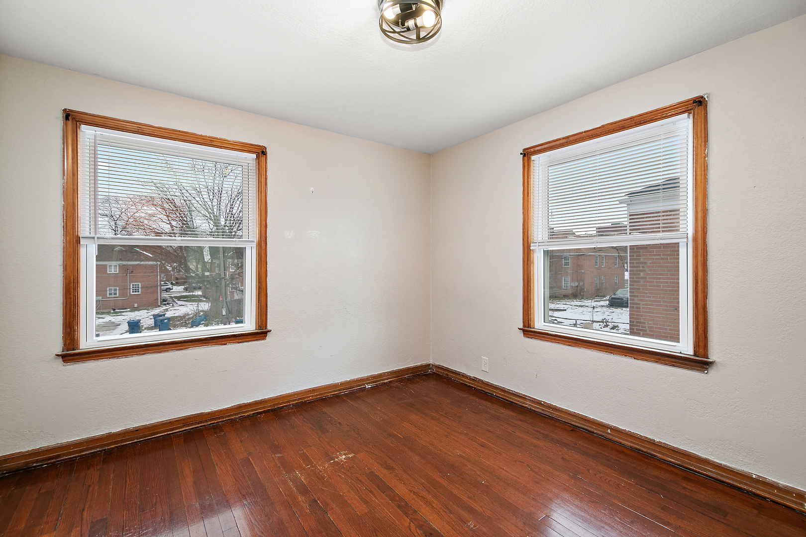 381 South Nelson Avenue Kankakee, IL 60901 - Photo 13 of 15 a view of an empty room with wooden floor and a window