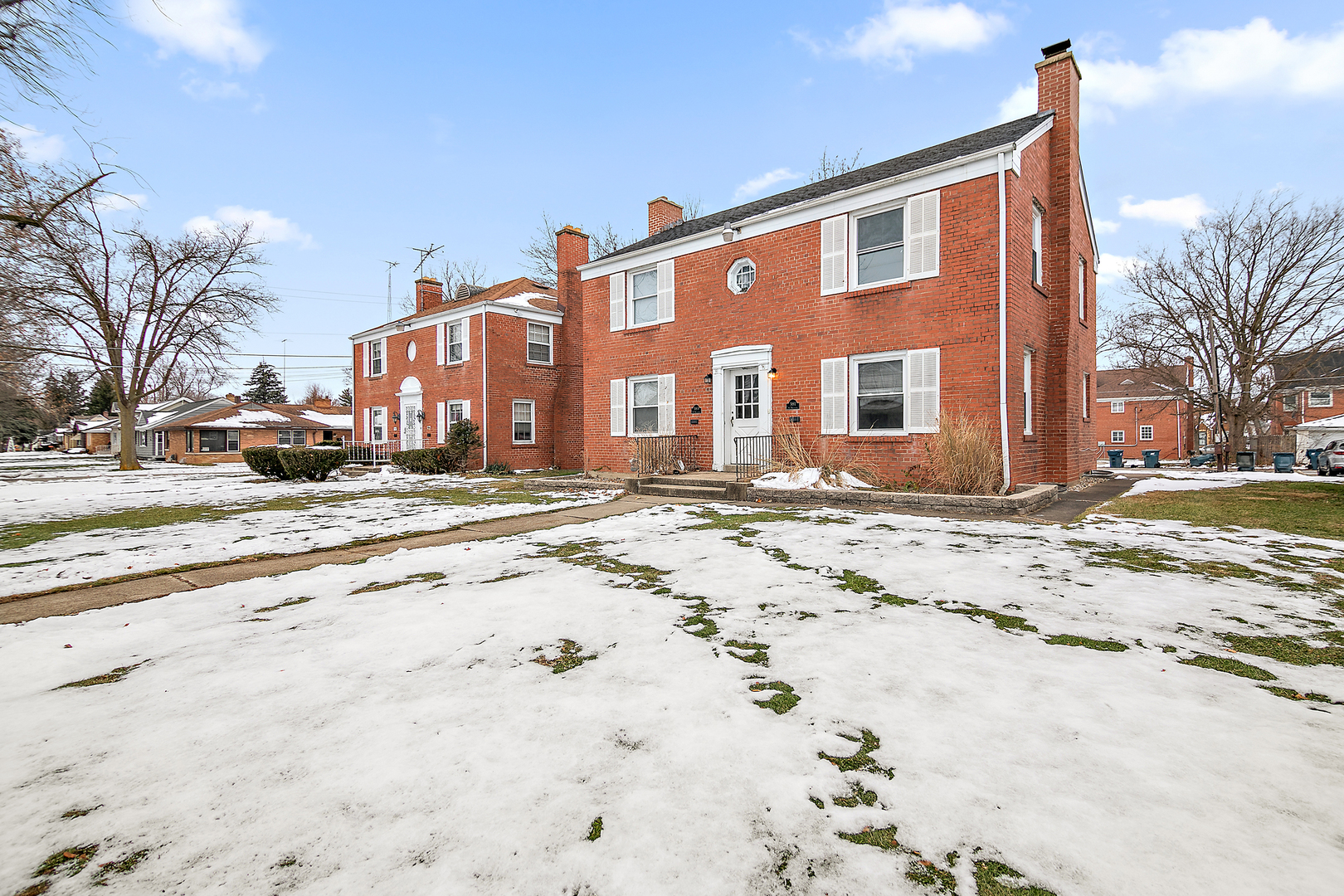 381 South Nelson Avenue Kankakee, IL 60901 - Photo 2 of 15 a front view of a house with a yard