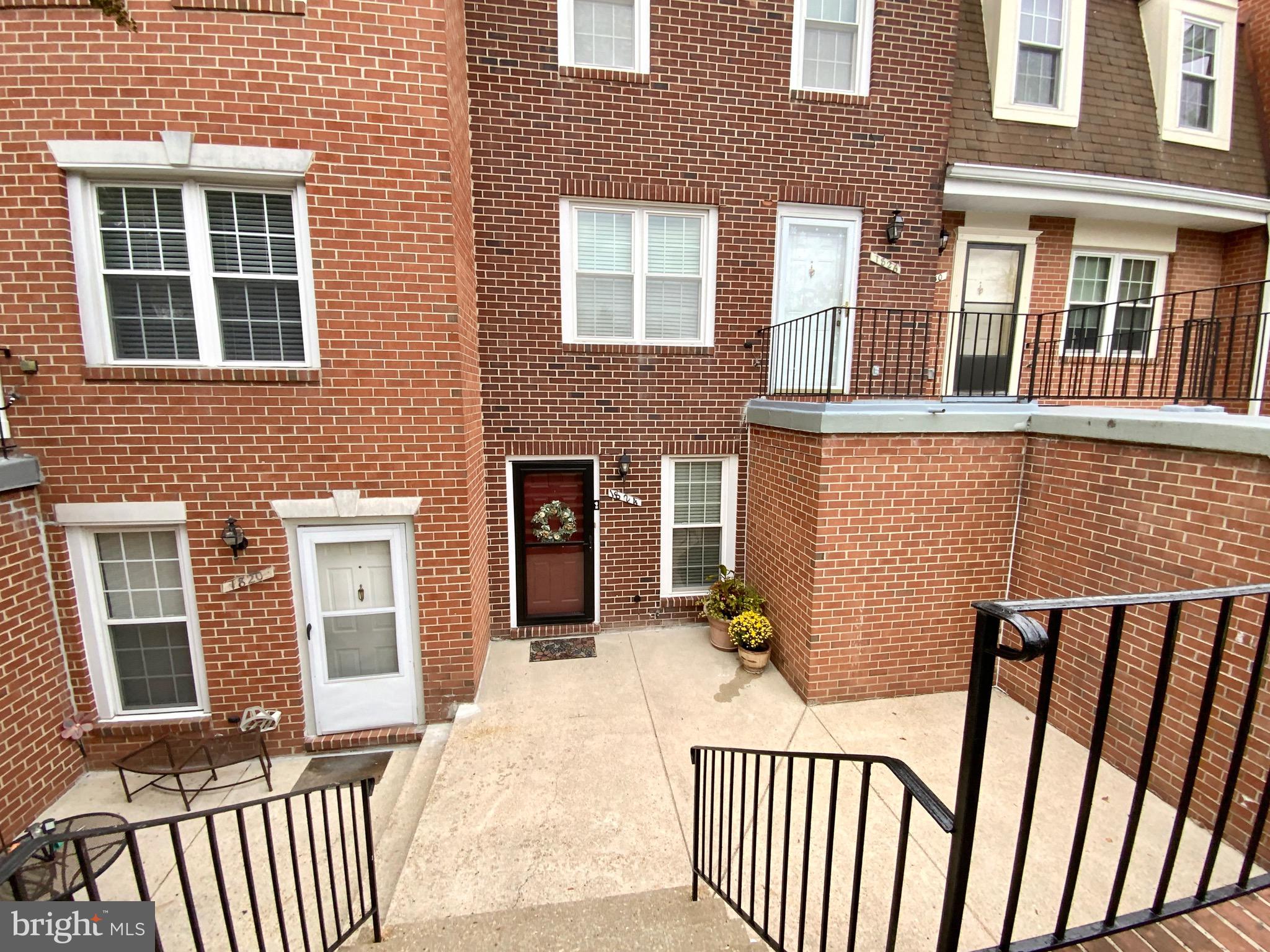 1824 Bronzegate Boulevard, Unit 182 Silver Spring, MD 20904 - Photo 1 of 14 a view of a brick house with large windows