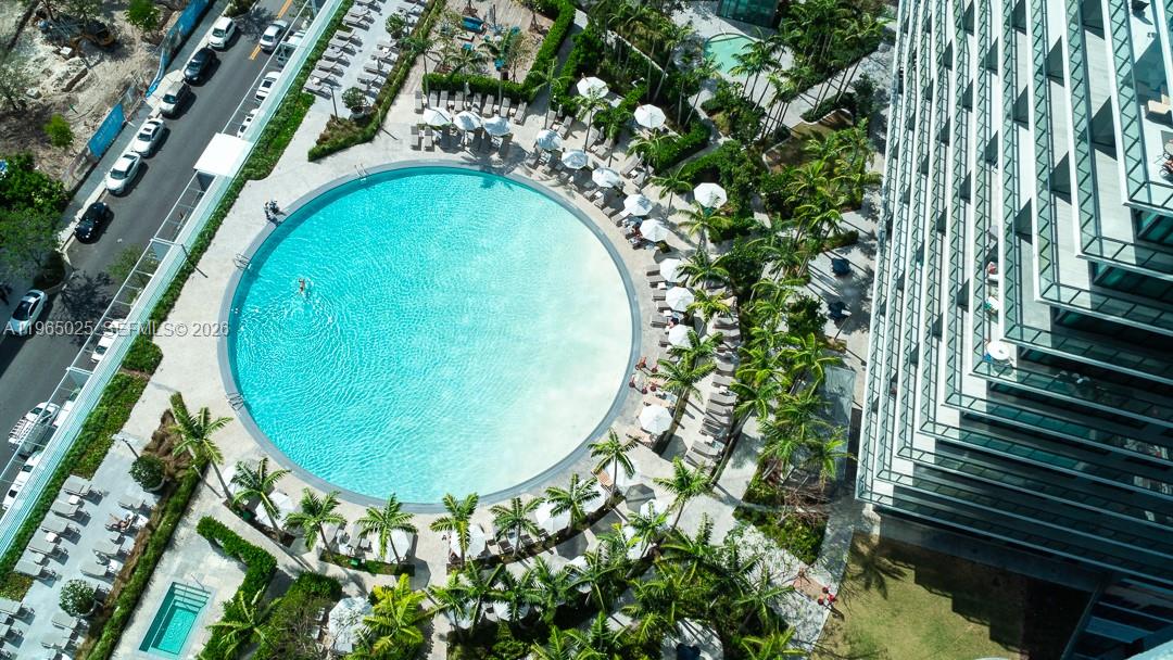 a view of a swimming pool with a yard