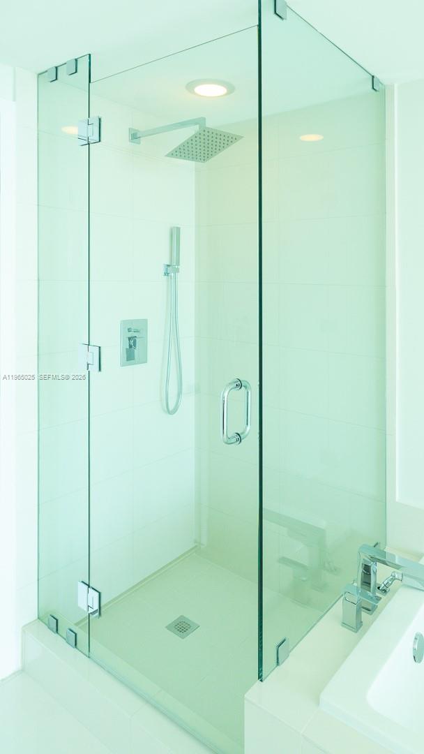 650 Northeast 32nd Street, Unit 2105 Miami, FL 33137 - Photo 12 of 61 a bathroom with a shower and a sink
