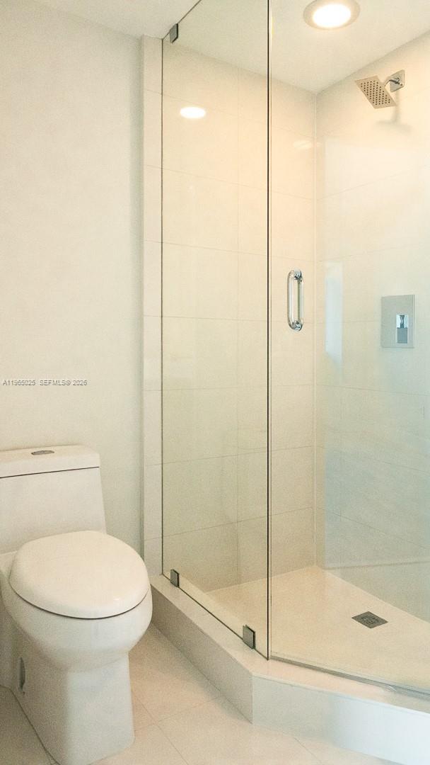 650 Northeast 32nd Street, Unit 2105 Miami, FL 33137 - Photo 20 of 61 a bathroom with a toilet and a shower