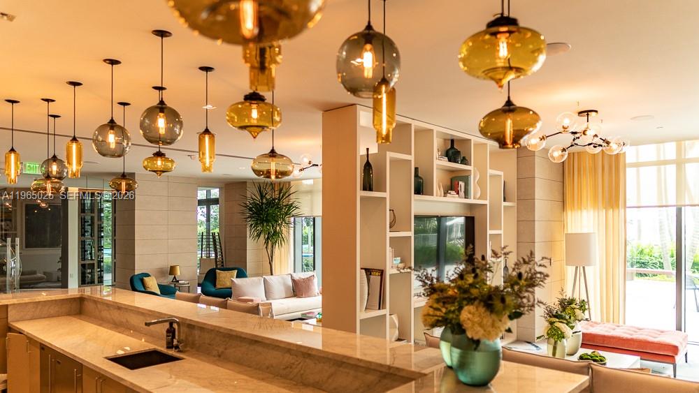 650 Northeast 32nd Street, Unit 2105 Miami, FL 33137 - Photo 34 of 61 a bathroom with a sink a mirror and potted plants