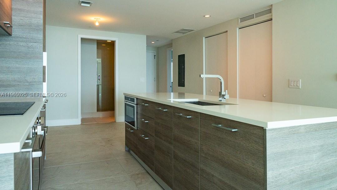 650 Northeast 32nd Street, Unit 2105 Miami, FL 33137 - Photo 5 of 61 a bathroom with a double vanity sink and a mirror