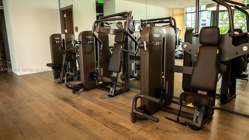650 Northeast 32nd Street, Unit 2105 Miami, FL 33137 - Photo 51 of 61 a view of a room with gym equipment