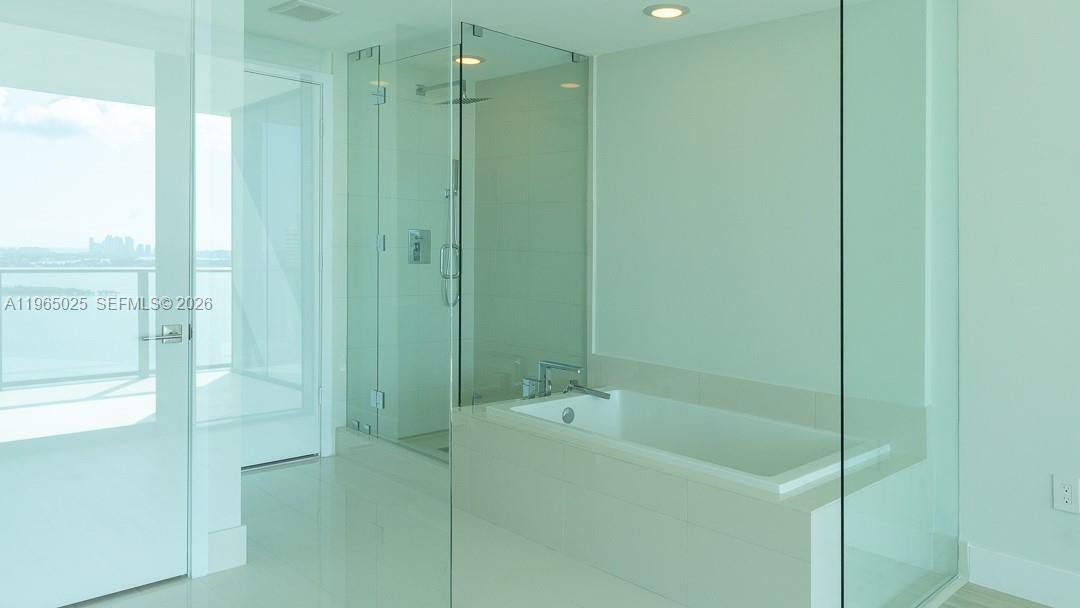650 Northeast 32nd Street, Unit 2105 Miami, FL 33137 - Photo 10 of 61 a bathroom with a shower and a sink