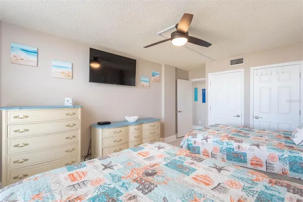 a bedroom with double bed and a window