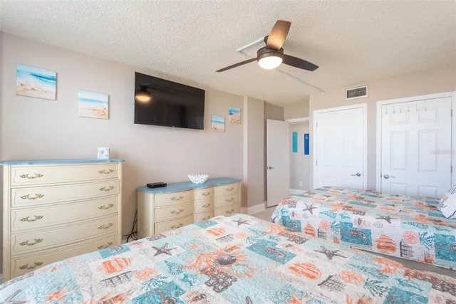 a bedroom with double bed and a window