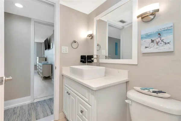 a large kitchen with kitchen island granite countertop a sink and a refrigerator