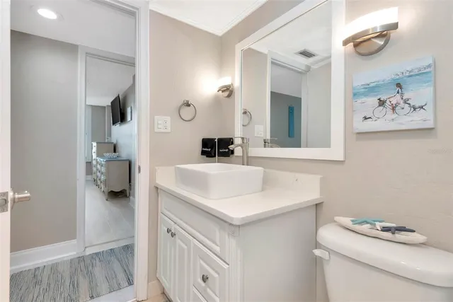 a large kitchen with kitchen island granite countertop a sink and a refrigerator