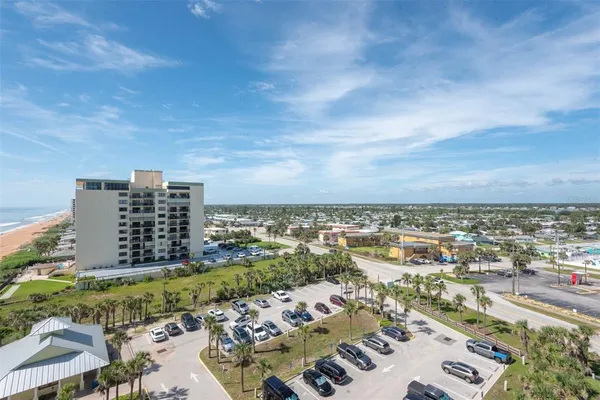 a view of a swimming pool with outdoor seating