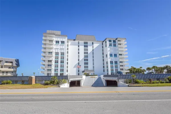 a view of a swimming pool with outdoor seating