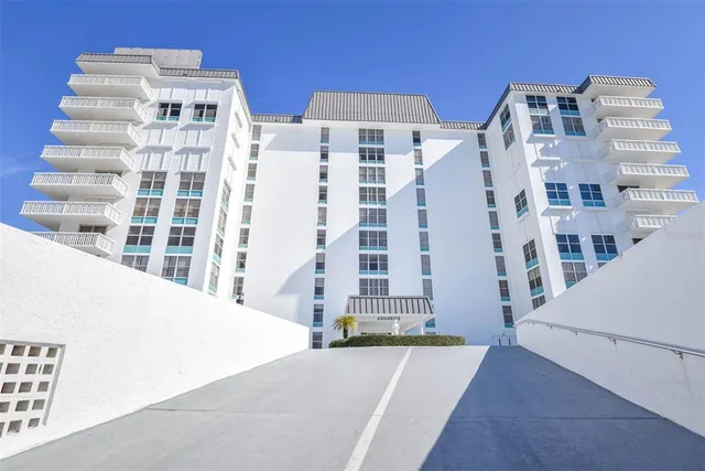 a view of a swimming pool with outdoor seating