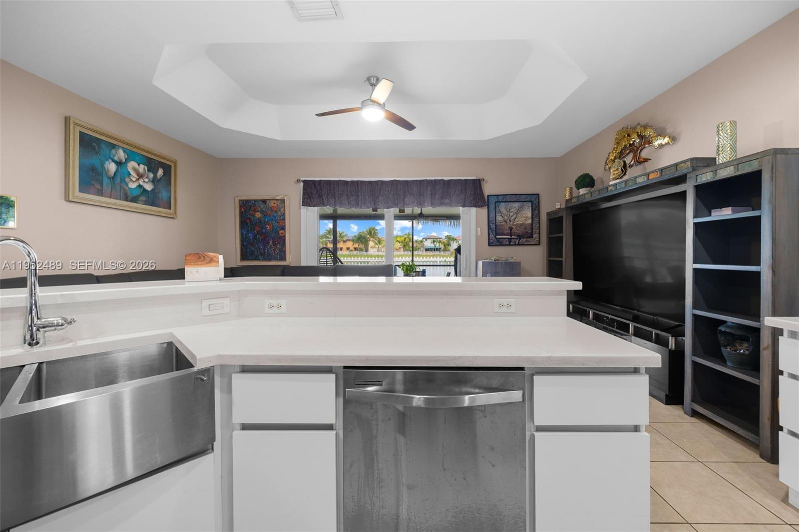 3985 Northeast 15th Street Homestead, FL 33033 - Photo 17 of 67 a kitchen with kitchen island stainless steel appliances a sink stove and refrigerator