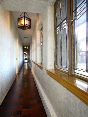 277 Gatesby Road Riverside, IL 60546 - Photo 5 of 15 a view of a hallway with windows and brick walls