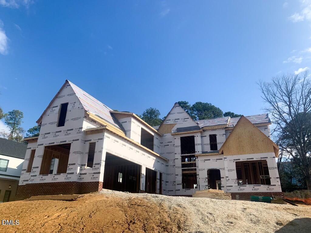 4112 Rockingham Street Raleigh, NC 27609 - Photo 1 of 67 a front view of a house with a yard