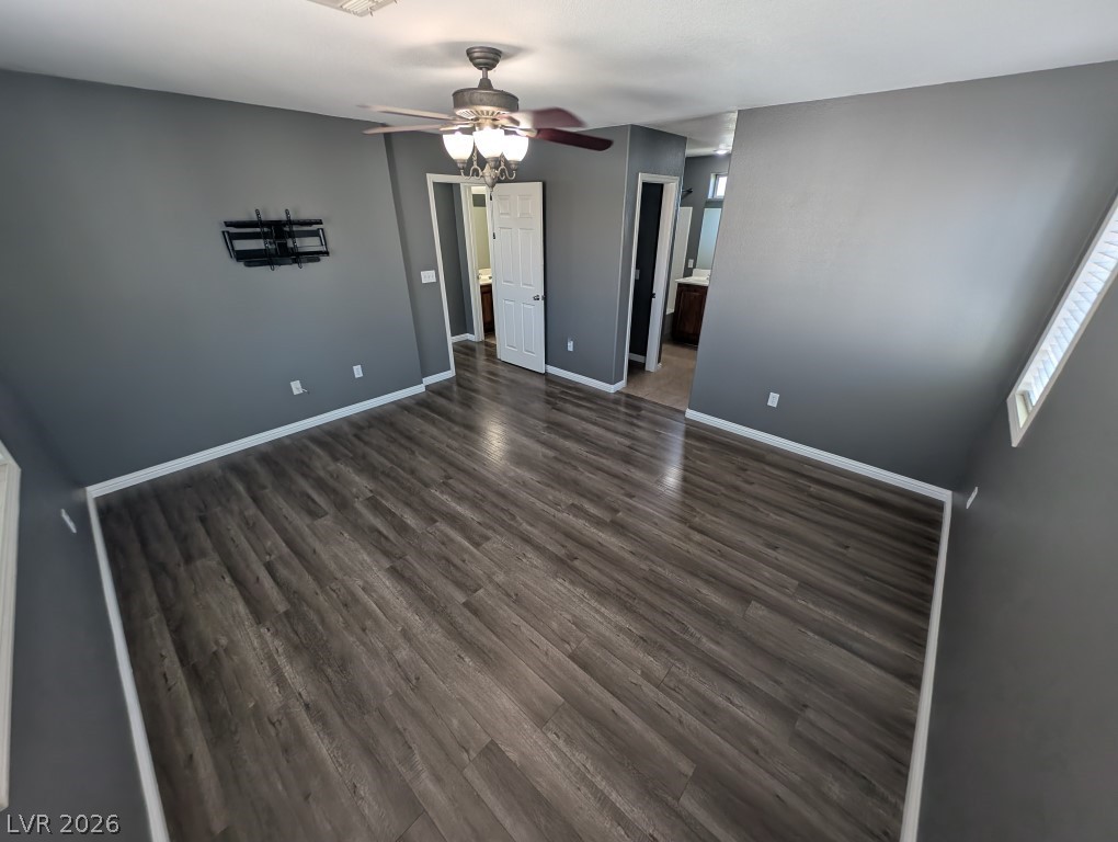 9121 Spoonbill Ridge Place Las Vegas, NV 89143 - Photo 13 of 26 Hardwood-style flooring extends across this spacious area, leading to multiple access points.