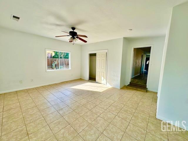 Undisclosed Address Bakersfield, CA 93308 - Photo 12 of 16 an empty room with fan and windows