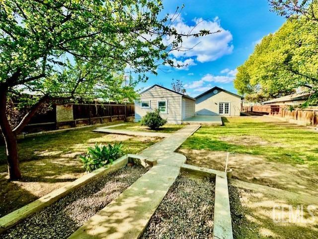 Undisclosed Address Bakersfield, CA 93308 - Photo 15 of 16 a view of swimming pool with a garden