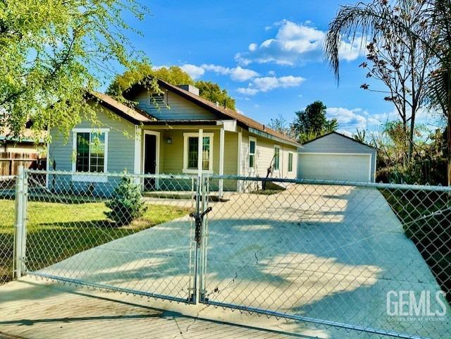Undisclosed Address Bakersfield, CA 93308 - Photo 2 of 16 a front view of a house with garden