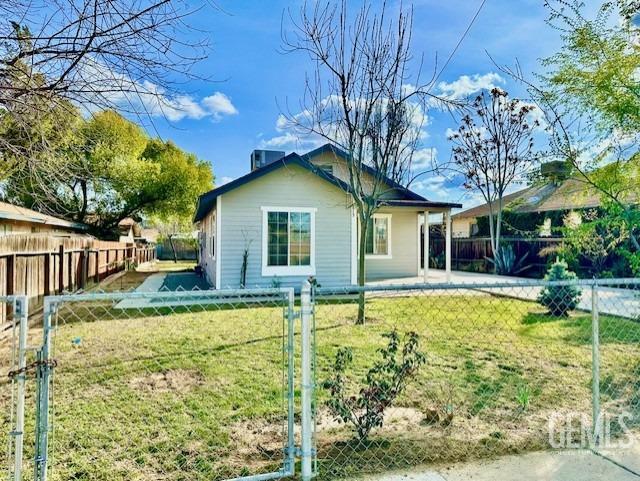 Undisclosed Address Bakersfield, CA 93308 - Photo 3 of 16 a view of a house with pool and chairs