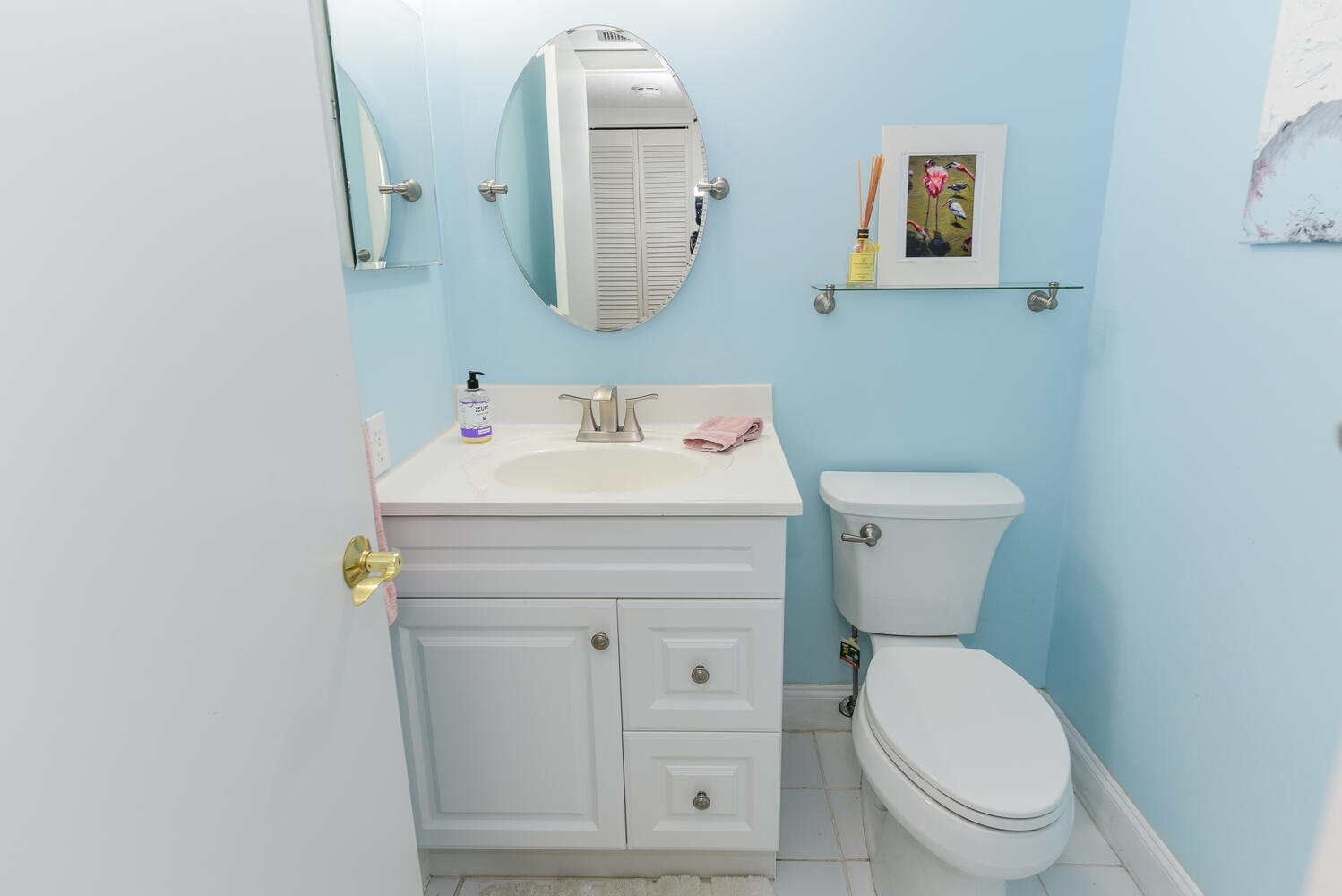 1605 Highway 1, Unit V4206 Jupiter, FL 33477 - Photo 11 of 30 a bathroom with a toilet sink and mirror
