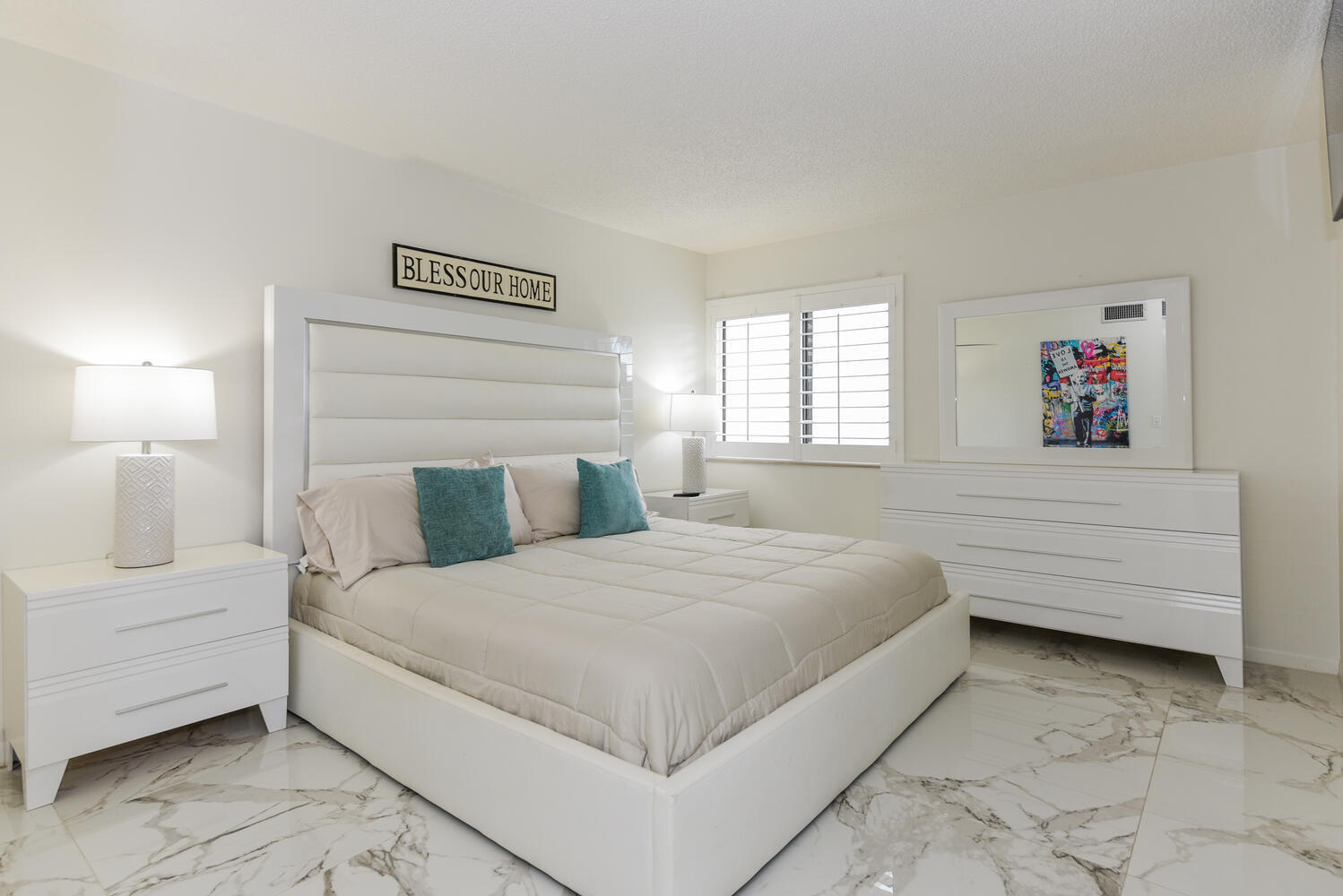 1605 Highway 1, Unit V4206 Jupiter, FL 33477 - Photo 12 of 30 a bedroom with a bed and a couch