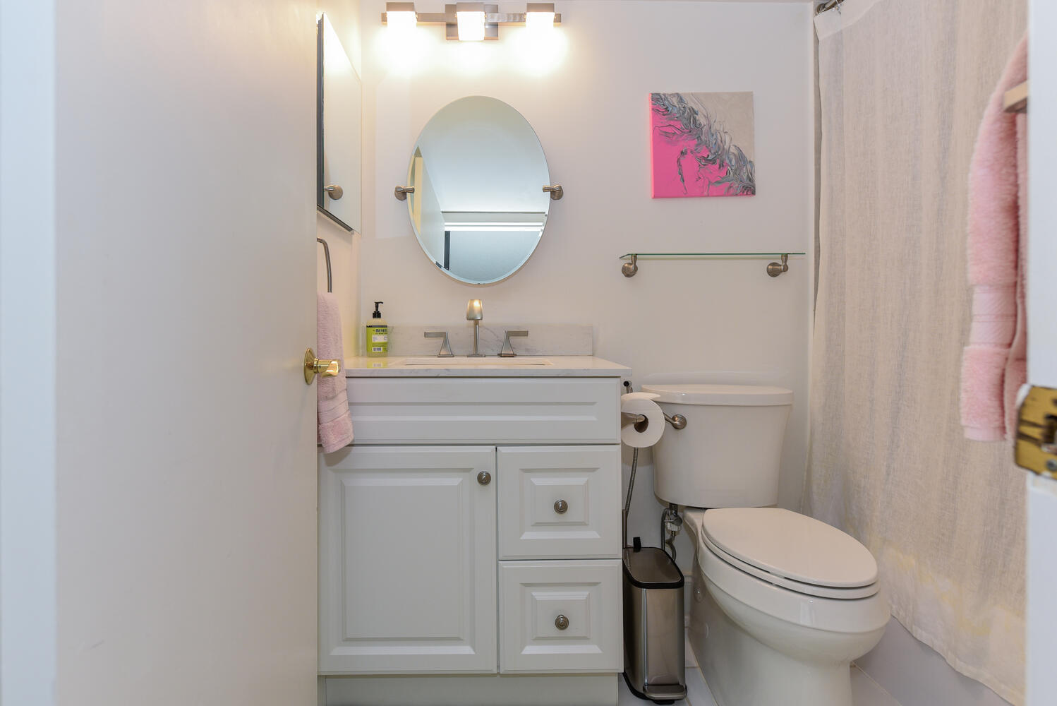 1605 Highway 1, Unit V4206 Jupiter, FL 33477 - Photo 14 of 30 a bathroom with a toilet a sink and a mirror