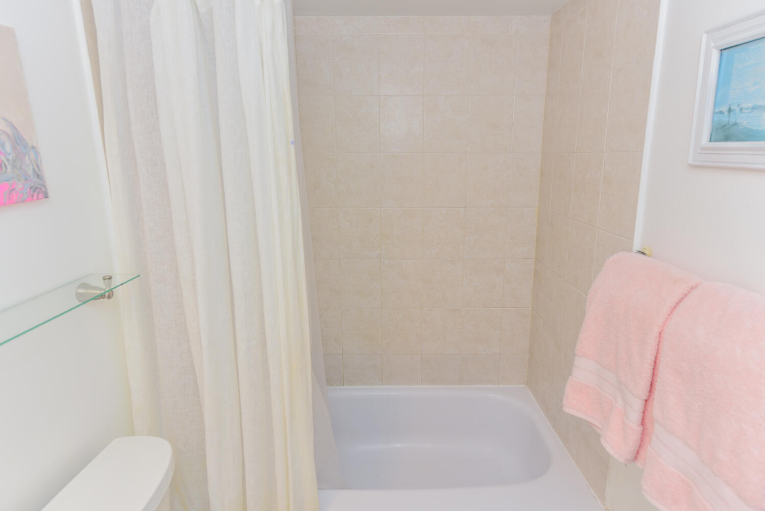 1605 Highway 1, Unit V4206 Jupiter, FL 33477 - Photo 15 of 30 a bathroom with a shower curtain and toilet