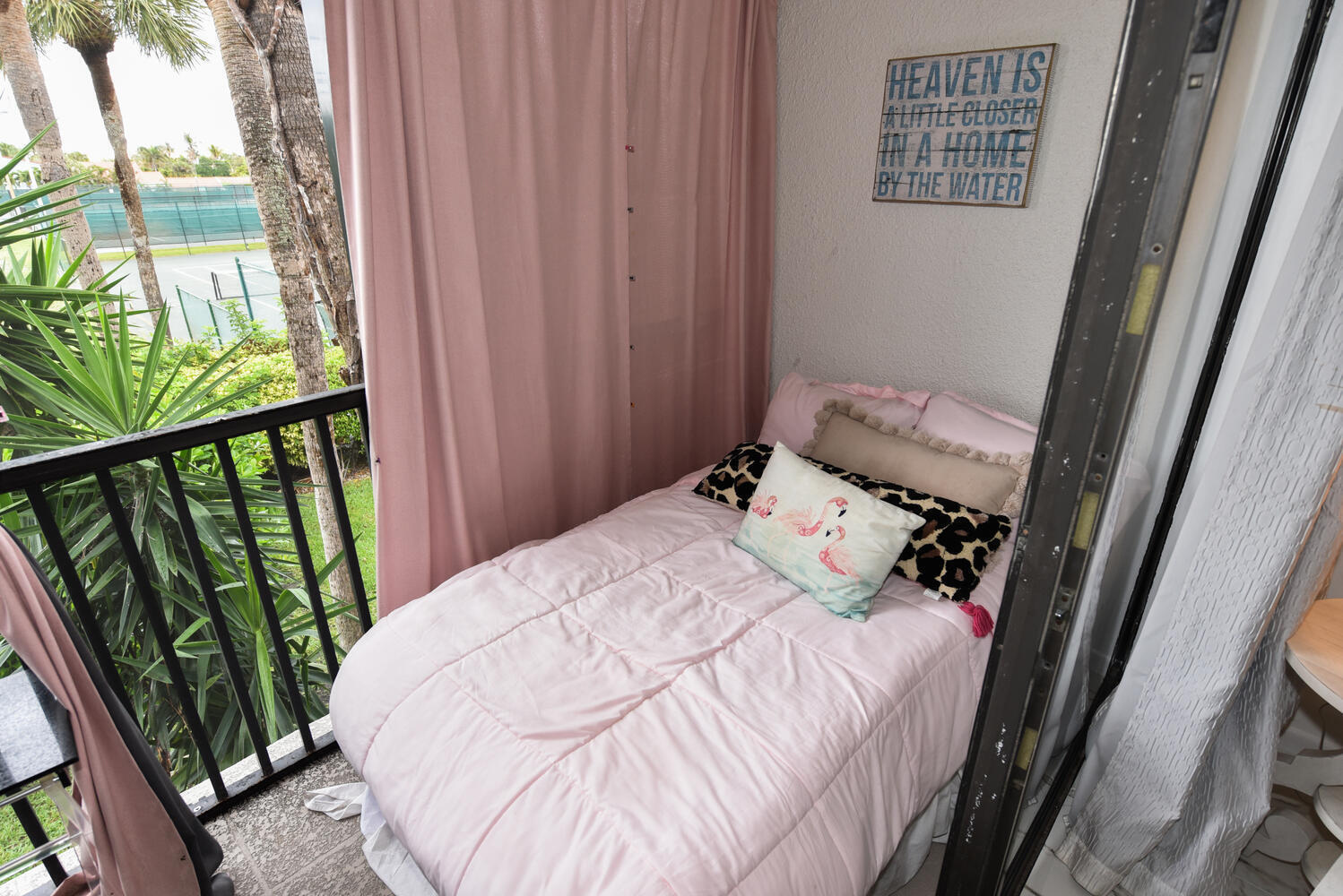1605 Highway 1, Unit V4206 Jupiter, FL 33477 - Photo 18 of 30 a bedroom with a bed and a window
