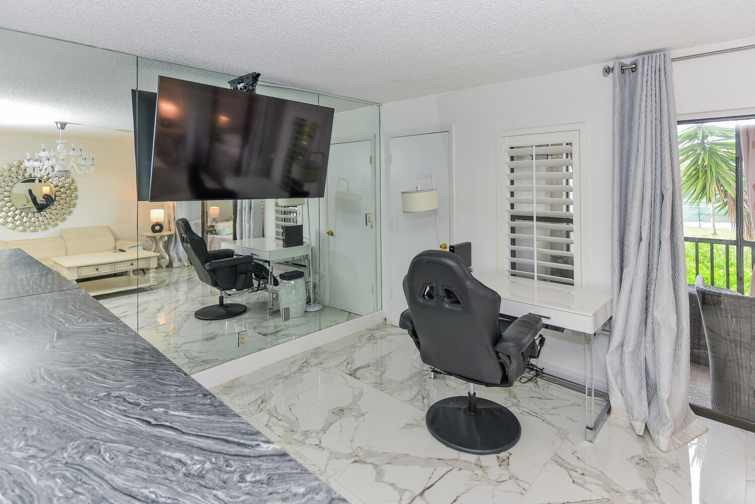 1605 Highway 1, Unit V4206 Jupiter, FL 33477 - Photo 6 of 30 a living room with furniture and a flat screen tv