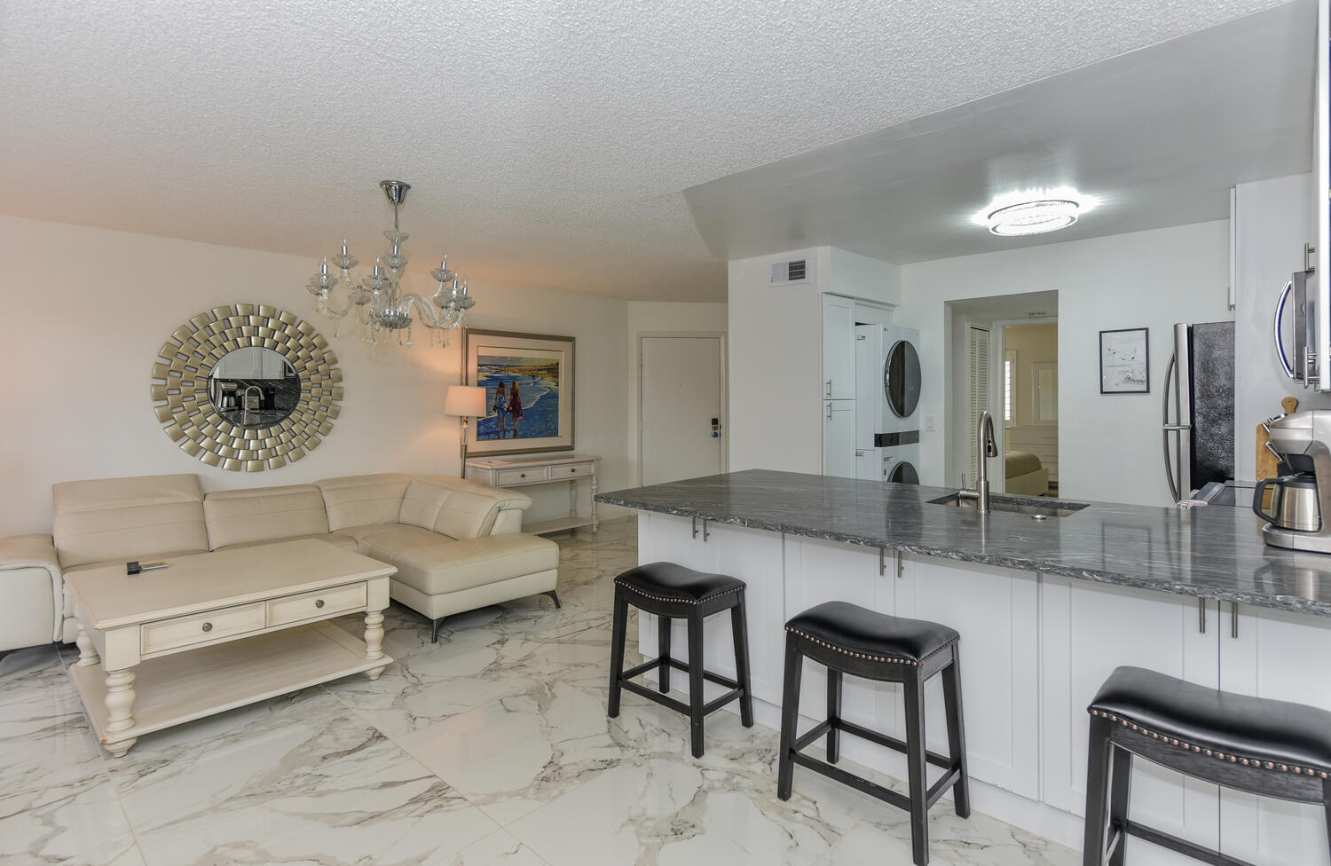 1605 Highway 1, Unit V4206 Jupiter, FL 33477 - Photo 7 of 30 a living room with furniture and a large mirror