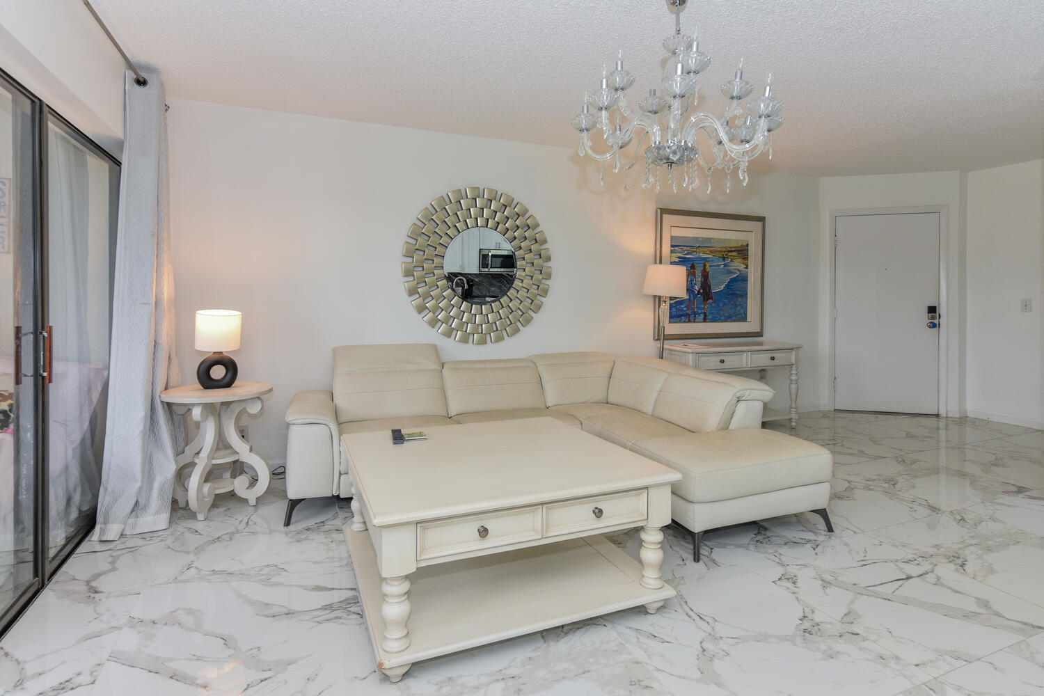 1605 Highway 1, Unit V4206 Jupiter, FL 33477 - Photo 8 of 30 a spacious bedroom with a bed and a chandelier