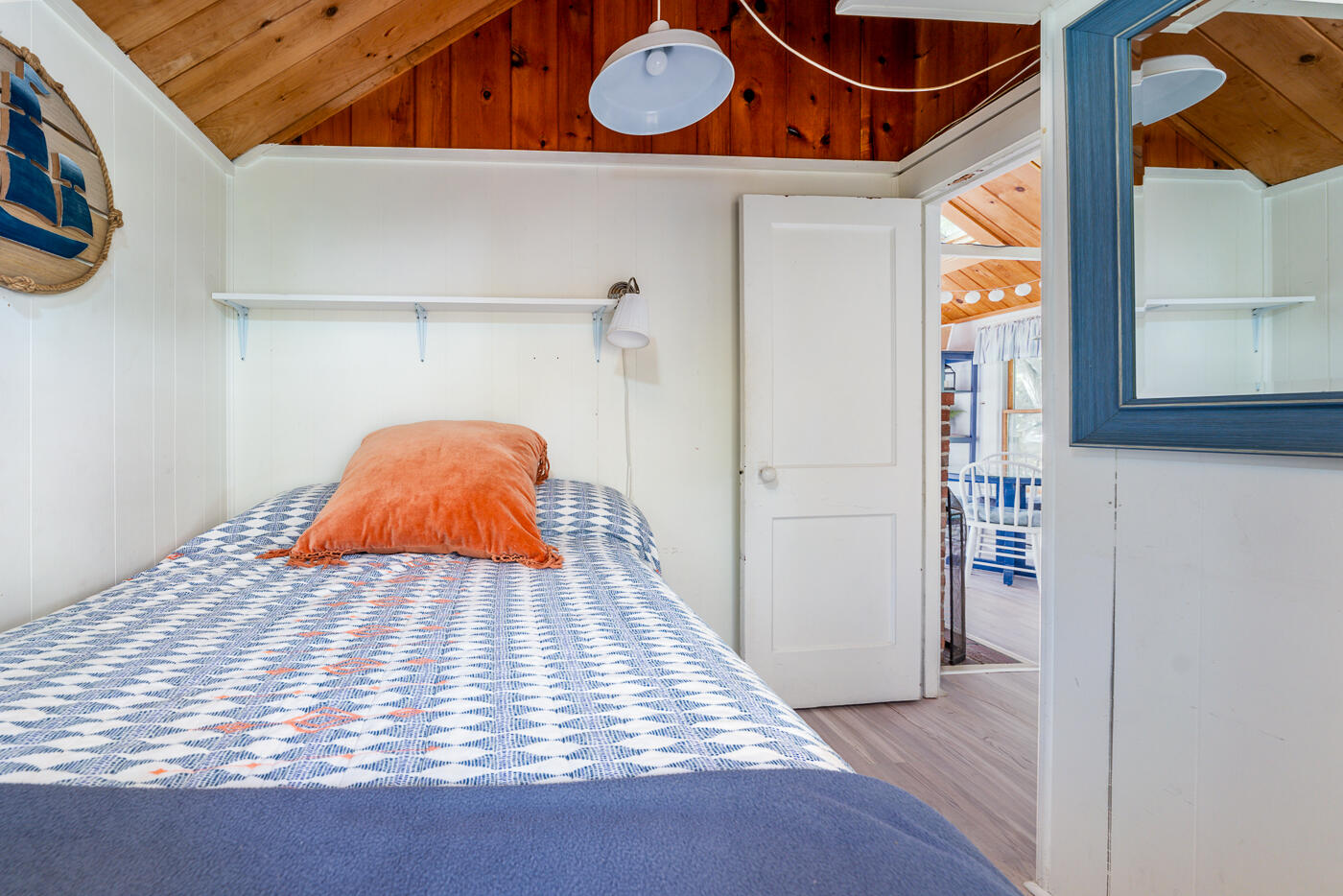 215 Pilgrim Spring Road, Unit G Wellfleet, MA 02667 - Photo 19 of 32 a view of a room with wooden floor and windows