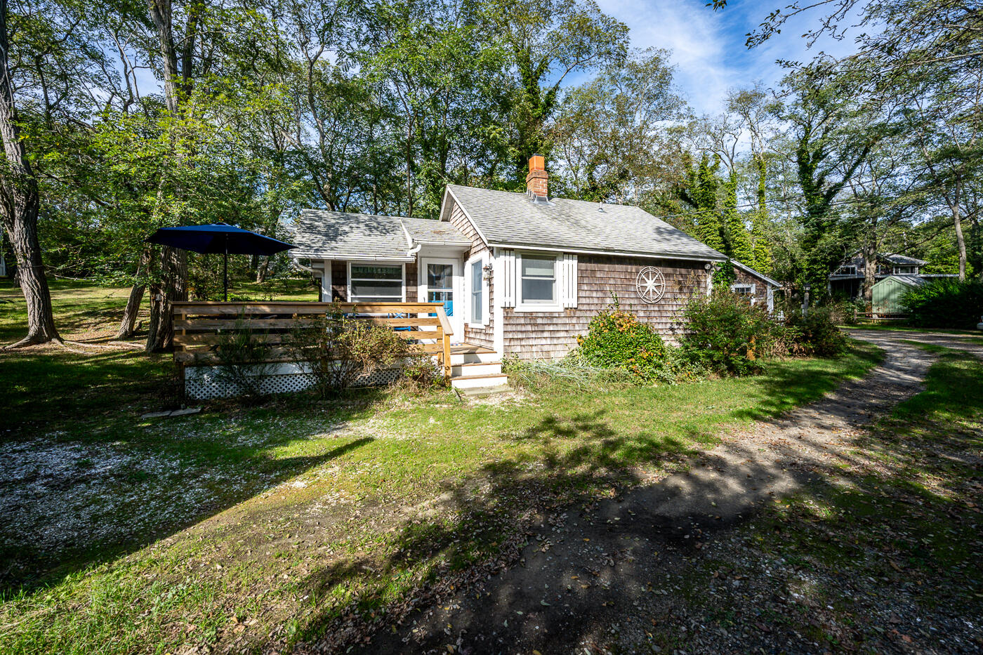 215 Pilgrim Spring Road, Unit G Wellfleet, MA 02667 - Photo 27 of 32 a front view of a house with garden
