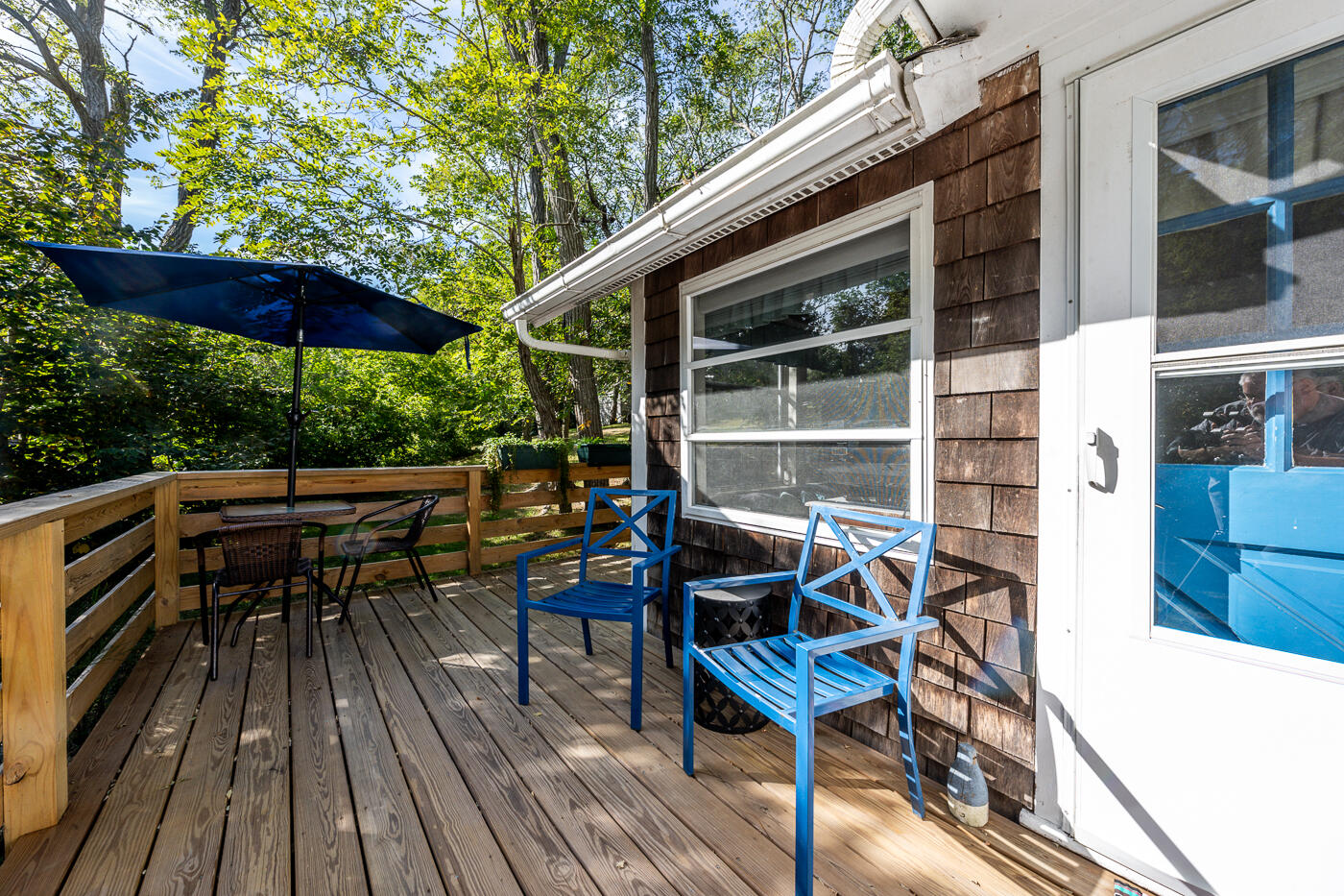 215 Pilgrim Spring Road, Unit G Wellfleet, MA 02667 - Photo 3 of 32 an outdoor space with furniture and umbrella