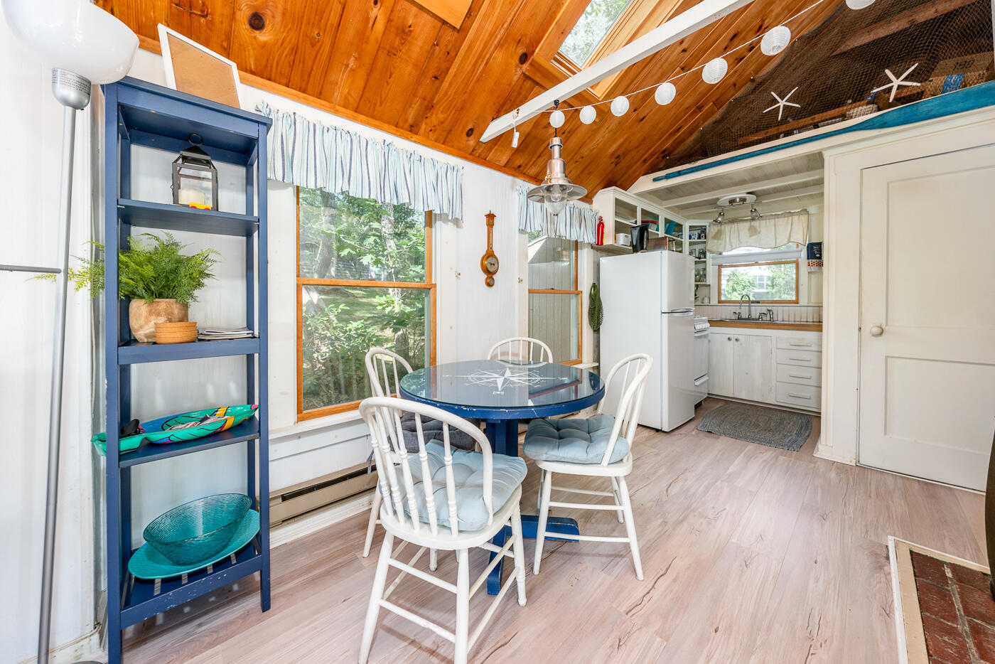 215 Pilgrim Spring Road, Unit G Wellfleet, MA 02667 - Photo 10 of 32 a view of a dining room with furniture window and wooden floor